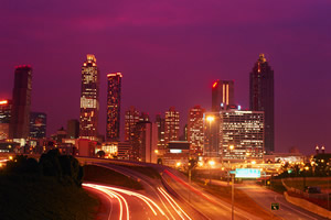 Traffic floods the city at night.